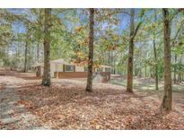 Brick ranch house with wooded backyard at 7030 Cascade Palmetto Hwy, Palmetto, GA 30268