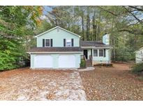 Ranch home with three-car garage and mature trees at 4027 Evelyn Dr, Powder Springs, GA 30127