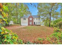 Two-story home with brick and vinyl siding, and a spacious yard at 5941 S Deshon Ct, Lithonia, GA 30058