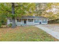 Charming ranch home with a front porch and mature landscaping at 3730 Douglas Ridge Trl, Douglasville, GA 30135