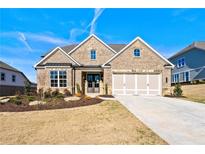 Brick ranch home with three-car garage at 2640 Joseph Dr, Cumming, GA 30028