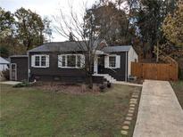 Charming ranch home with landscaped yard and wooden fence at 2329 Ava Place, Decatur, GA 30033