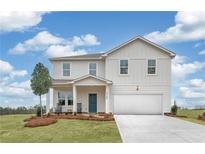 Two-story house with white siding, green door, and a two-car garage at 3621 Olive Grove Ln, Covington, GA 30016