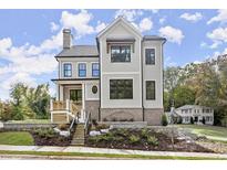 Two-story house with gray siding and brick accents at 3794 Wynn Walk, Brookhaven, GA 30341