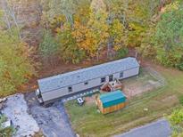 Single wide mobile home with shed and fenced yard at 4921 Pickys Se Holw, Acworth, GA 30102