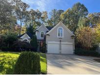 Two story house with double garage and landscaped yard at 2698 Claredon Nw Trce, Kennesaw, GA 30144