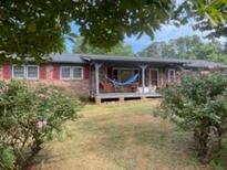 Ranch home with covered porch and large yard at 745 Shiloh Nw Rd, Kennesaw, GA 30144