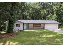 Newly renovated home featuring a modern facade and landscaped lawn at 3918 Artist Vw, Decatur, GA 30034