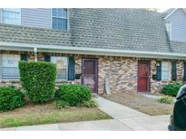 Brick front exterior of townhome with landscaping and walkway at 3103 Reeves Se St, Smyrna, GA 30080