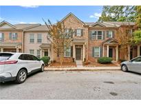 Brick townhouse with front yard and parking at 2357 Bayrose Cir # 57B, East Point, GA 30344