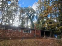 Brick ranch house with mature trees at 276 Lydia Se Dr, Atlanta, GA 30315