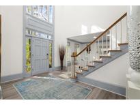 Bright entryway with high ceilings, gray walls, and stylish rug at 2680 Spalding Dr, Sandy Springs, GA 30350