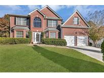 Two-story brick home with a large yard at 743 Pine Bark Rd, Stone Mountain, GA 30087