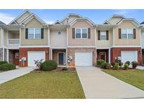 Three-unit townhome complex with garages at 2085 Hasel St, Lawrenceville, GA 30044