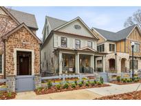 Charming two-story home with a classic design and landscaped front yard at 109 Cumming St, Alpharetta, GA 30009