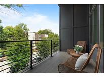 Relaxing balcony with wicker chairs and city views at 437 Parkway Ne Dr, Atlanta, GA 30308