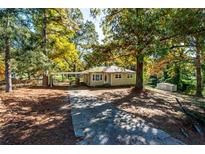 Ranch home with carport and mature trees at 6055 Blackhawk Se Trl, Mableton, GA 30126