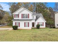 Two-story house with attached garage at 4103 Kingship Dr, Ellenwood, GA 30294