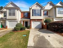 Two story townhome with two car garage and landscaping at 3781 Harvest Dr, Decatur, GA 30034