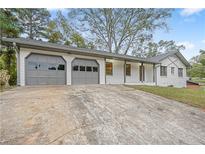 Updated ranch home with a two-car garage and a long driveway at 4647 Wonder Valley Trl, Decatur, GA 30034