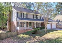 Two-story house with front porch and yard at 2864 Holly Oaks Dr, Marietta, GA 30062