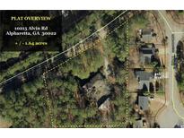 Aerial view of property showing house and 1.64 acres of land at 10215 Alvin Rd, Alpharetta, GA 30022