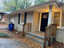 Brick ranch house exterior, front entrance, steps, and landscaping at 3137 Mcafee Rd, Decatur, GA 30032