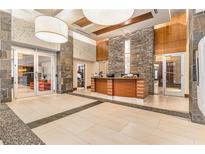 Elegant lobby with stone accents, modern seating, and a welcoming reception desk at 3300 Windy Ridge Se Pkwy # 718, Atlanta, GA 30339
