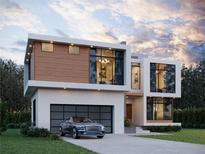 Modern two-story home with attached garage and landscaped lawn at 1103 Lynmoor Ne Dr, Brookhaven, GA 30319