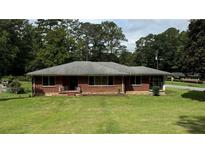 Brick ranch house with large yard and mature trees at 539 Lynhurst Sw Dr, Atlanta, GA 30311