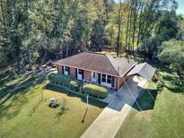Brick ranch home with a carport and spacious yard at 197 Dixboro Dr, Jonesboro, GA 30238
