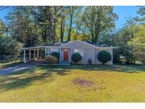 Ranch style house with carport and green lawn at 3289 Beech Dr, Decatur, GA 30032