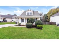 Charming one-story house with a well-manicured lawn and front porch at 417 Tina Hely Ct, Stockbridge, GA 30281