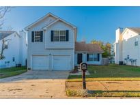 Two-story home with attached two-car garage at 135 Labrea Blvd, Mcdonough, GA 30253