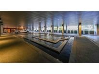 Elegant building entrance with a serene water fountain feature at 145 15Th Ne St # 401, Atlanta, GA 30309