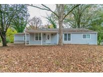 Ranch style home with light blue siding and covered porch at 2229 Whites Mill Rd, Decatur, GA 30032