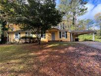 Ranch home with carport and mature trees at 2931 Two Lake Cir, Atlanta, GA 30349