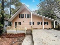 Exterior of charming light pink house with deck at 4405 Cary Dr, Snellville, GA 30039