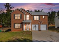 Brick two-story house with a two-car garage and a basketball goal at 6634 Pine Valley Trce, Stone Mountain, GA 30087