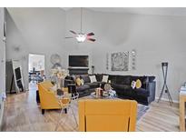 Spacious living room featuring a cozy seating arrangement and stylish decor at 3628 Walnut Creek Way, Lithonia, GA 30038