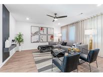 Spacious living room features a comfortable sectional sofa, stylish armchairs, and large-scale art at 392 Pratt Se Dr # 2023, Atlanta, GA 30315