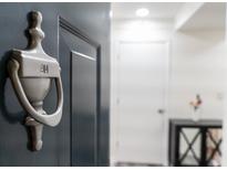 Apartment entry with silver door knocker and number 914 at 1280 W Peachtree Nw St # 914, Atlanta, GA 30309