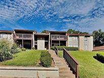 Two-story apartment building with balconies and landscaped grounds at 3575 Oakvale Rd # 305, Decatur, GA 30034