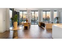 Open living area with hardwood floors, city views, and modern furniture at 3107 Peachtree Ne Rd # 1502, Atlanta, GA 30305