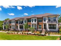 Modern townhouses with brick accents and private balconies at 358 Olmstead Way # 25, Alpharetta, GA 30022