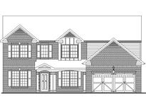 Two-story brick home with a three-car garage and dormer windows at 6145 Grindle Rd, Cumming, GA 30041