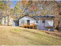 Charming ranch home with wood deck and carport at 2870 Aunt Pitty Pat Ln, Douglasville, GA 30135