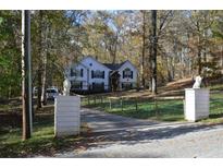Two story house with white siding, black shutters, and a large yard at 5673 Yorktown Rd, Douglasville, GA 30135