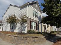 Two-story house with gray and white siding, stone accents, and landscaping at 602 Lofty Sw Ln, Atlanta, GA 30331