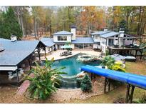 Luxury home with pool, waterslide, and lake access at 2440 Emerald Dr, Jonesboro, GA 30236